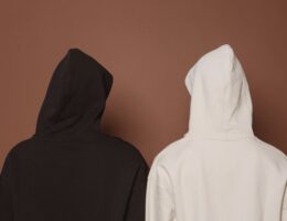 models and black and white hoodies in studio