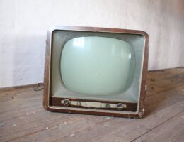 vintage brown crt tv on parquet wood flooring