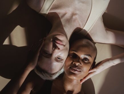 sensual diverse women lying on floor; racism